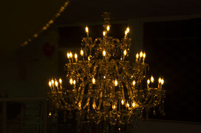 Low angle view of illuminated lights at night