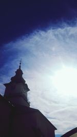 Low angle view of built structure against cloudy sky