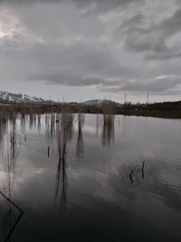 Scenic view of frozen lake against sky