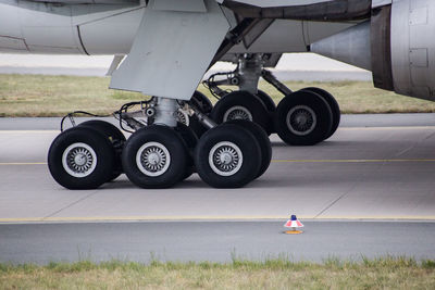 Cropped image of airplane on runway