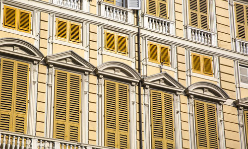 Distinctive yellow facade of the house 