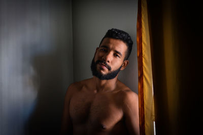 Portrait of young man looking away