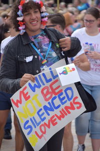 Close-up of girl holding text