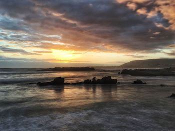 Scenic view of sea against dramatic sky