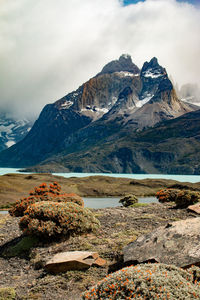 Idyllic shot of rocky mountains against cloudy sky