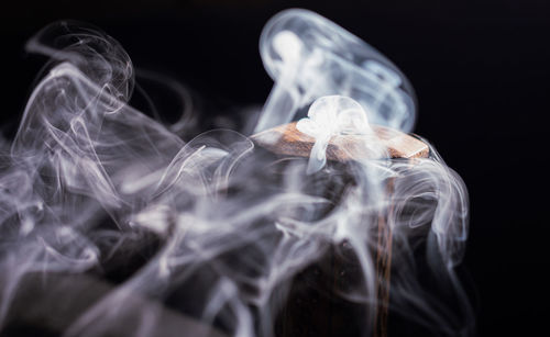 Close-up of smoke against black background