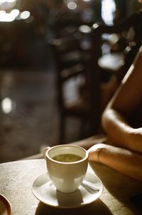 Close-up of coffee cup on table in cafe