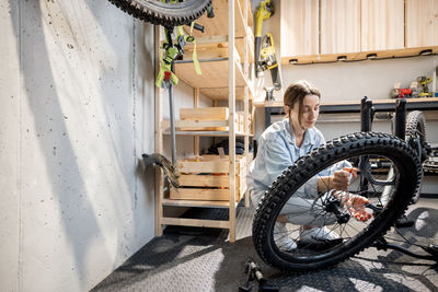 Woman standing in bicycle