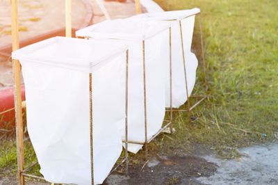 Close-up of white umbrella on field