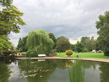 Reflection of trees in lake against sky