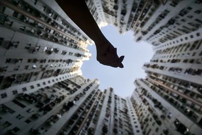 Low angle view of buildings against sky in city