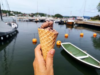 Cropped image of hand holding ice cream cone