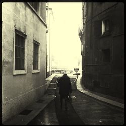 Full length of woman walking in city