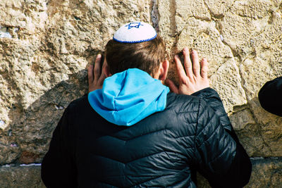 Rear view of man on rock