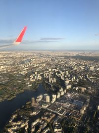 Aerial view of city and buildings against sky