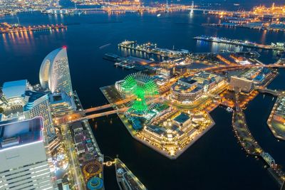 Aerial view of illuminated city at night