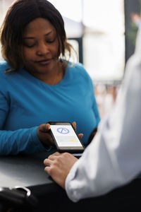 Young woman using mobile phone