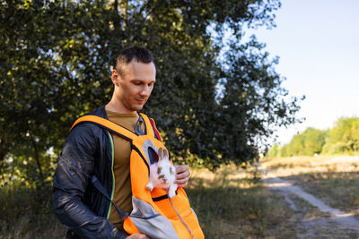 Portrait of young man standing outdoors