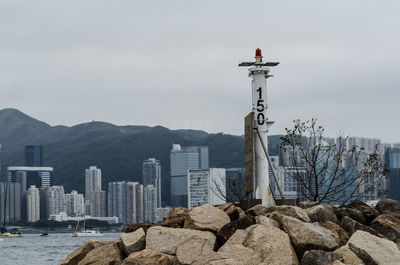 View of sea and city against sky