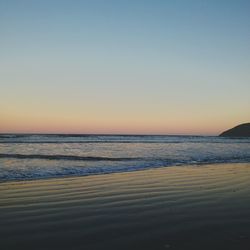 Scenic view of sea at sunset