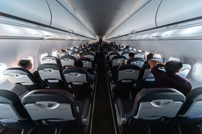 Rear view of people sitting in bus