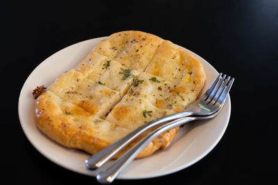 High angle view of bread in plate on table