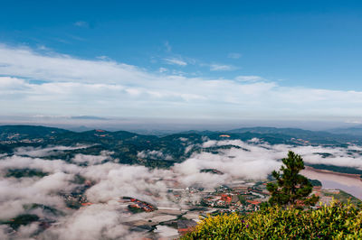 High angle view of city buildings against sky