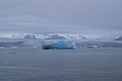 Scenic view of sea against sky during winter