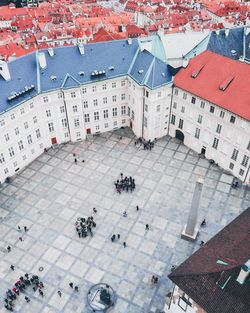 High angle view of people on street amidst buildings in city