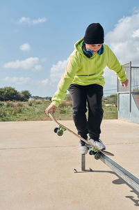 Full length of boy skateboarding