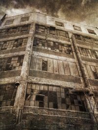 Low angle view of old building against sky