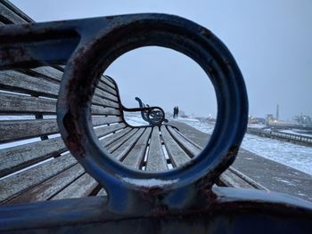 Close-up of bench at beach