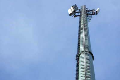 Low angle view of communications tower against sky