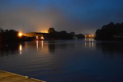 Scenic view of lake against sky at night