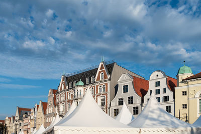 Low angle view of buildings in city against sky