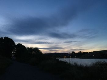 Scenic view of lake against sky at sunset