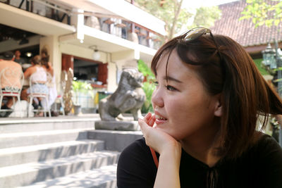 Close-up of woman looking away outdoors