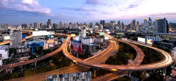 High angle view of road amidst buildings in city against sky