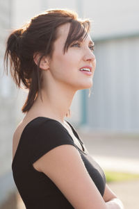 Young woman from the side looking away