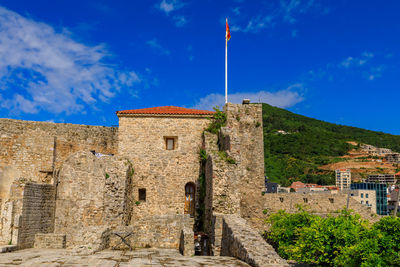 Low angle view of old ruins against sky