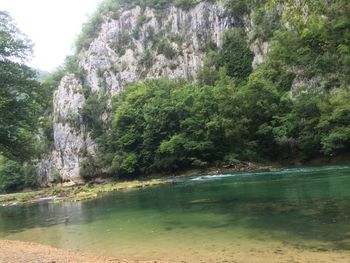 Scenic view of sea with mountain in background