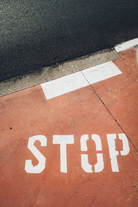 High angle view of arrow sign on road in city