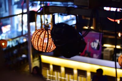 Close-up of illuminated lanterns hanging at restaurant