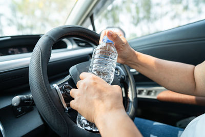 Low section of man driving car