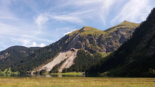 Panoramic view of lake and mountains against sky