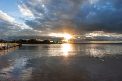 Scenic view of lake against sky during sunset