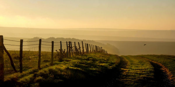 Scenic view of landscape against sky during sunset