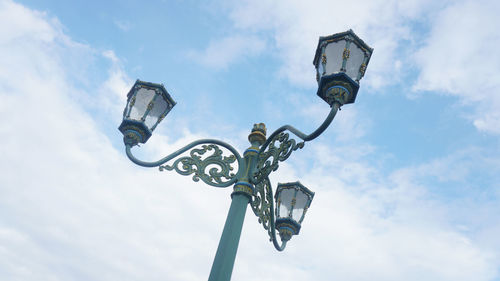 Low angle view of street light against sky