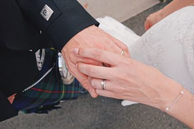 High angle view of couple holding hands