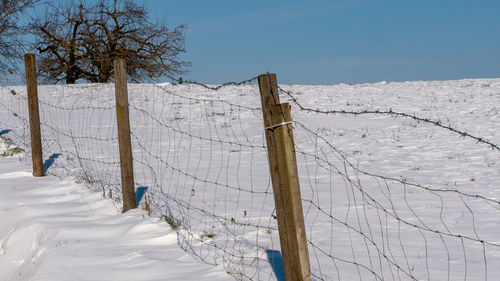 Fence in the snowy landscape